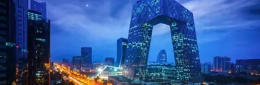 Night cityscape with buildings and road in Beijing, China 