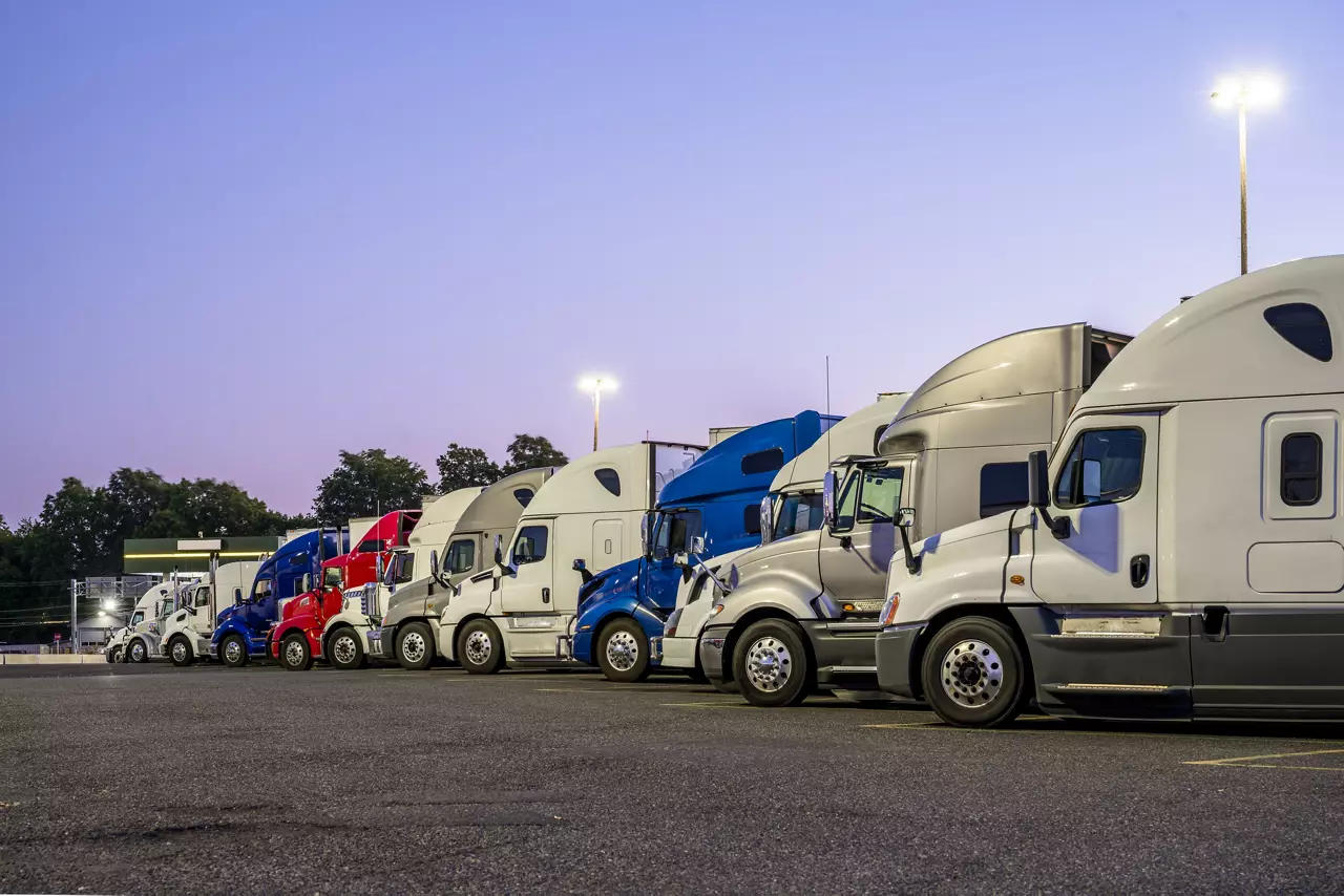 Line of different big rigs semi trucks