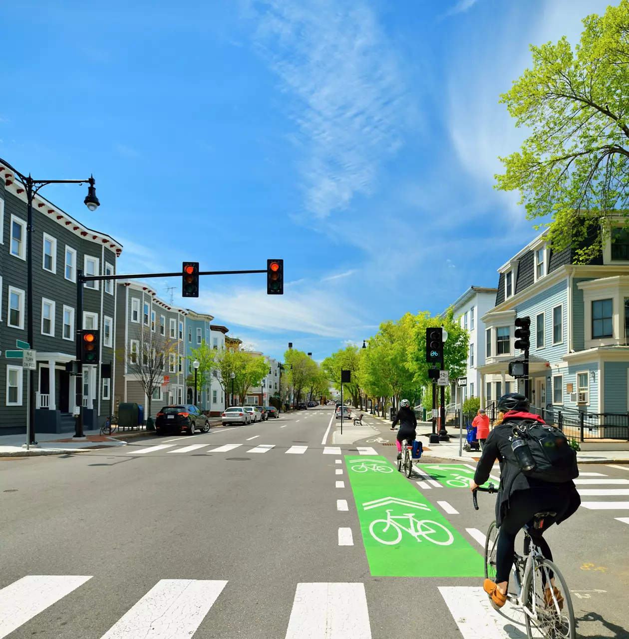 Protected bike lane between parking lane and sidewalk.
