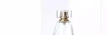 Perfume bottle and white packaging boxes, transparent glass spray mockup